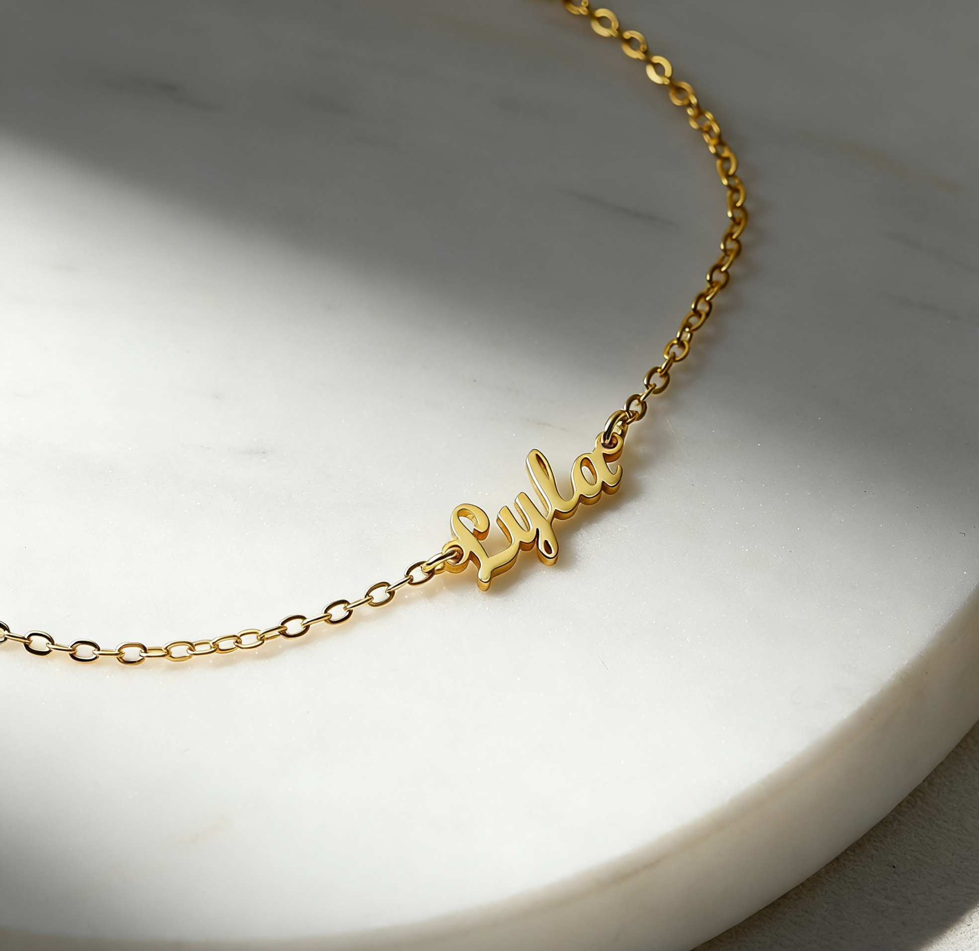 Custom gold name anklet on marble — couple ankle bracelet by CustomAnklets.com