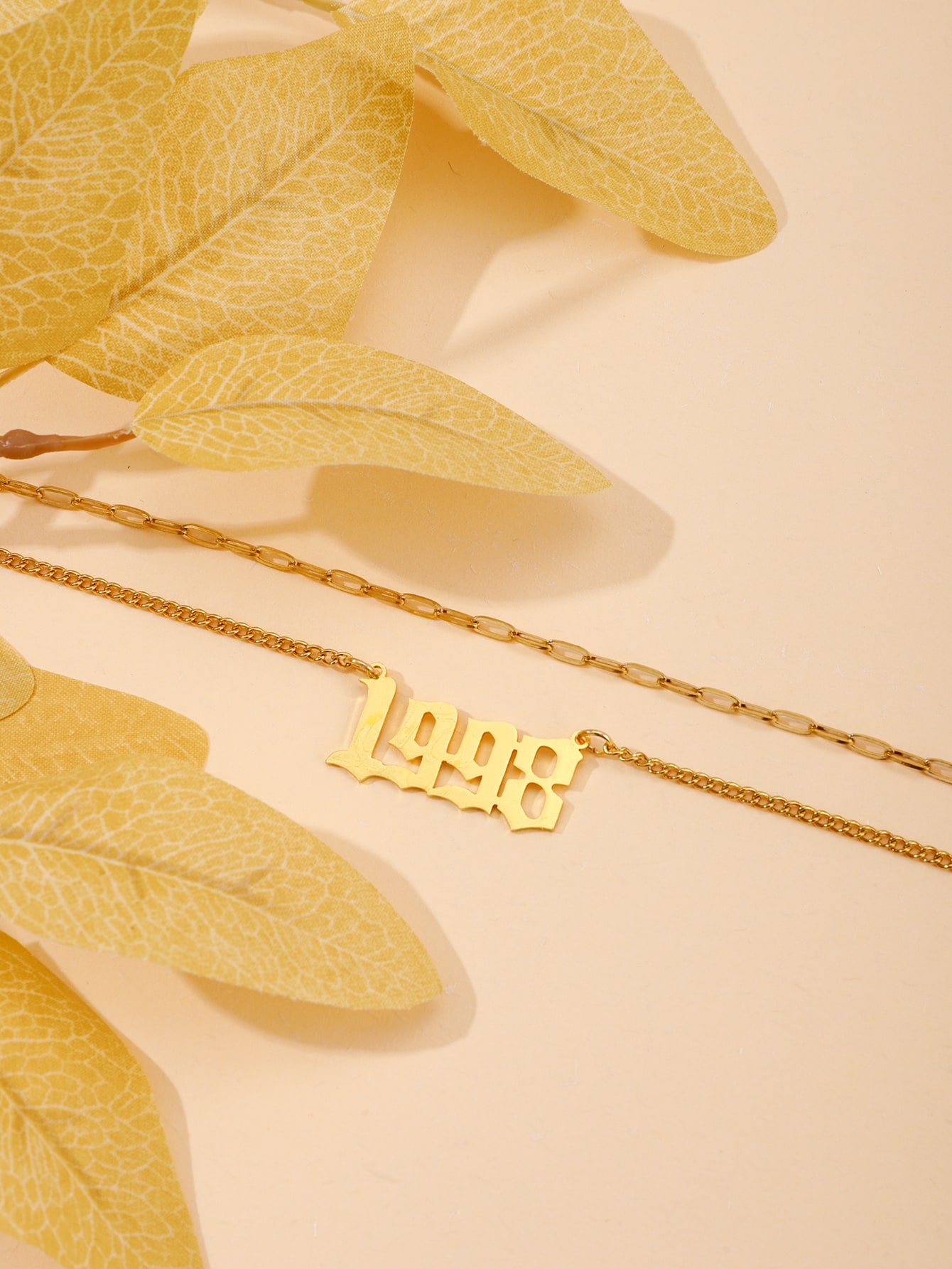 Custom date anklet worn on ankle — personalized jewelry by CustomAnklets.com