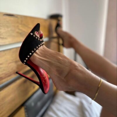 a person's feet in high heels