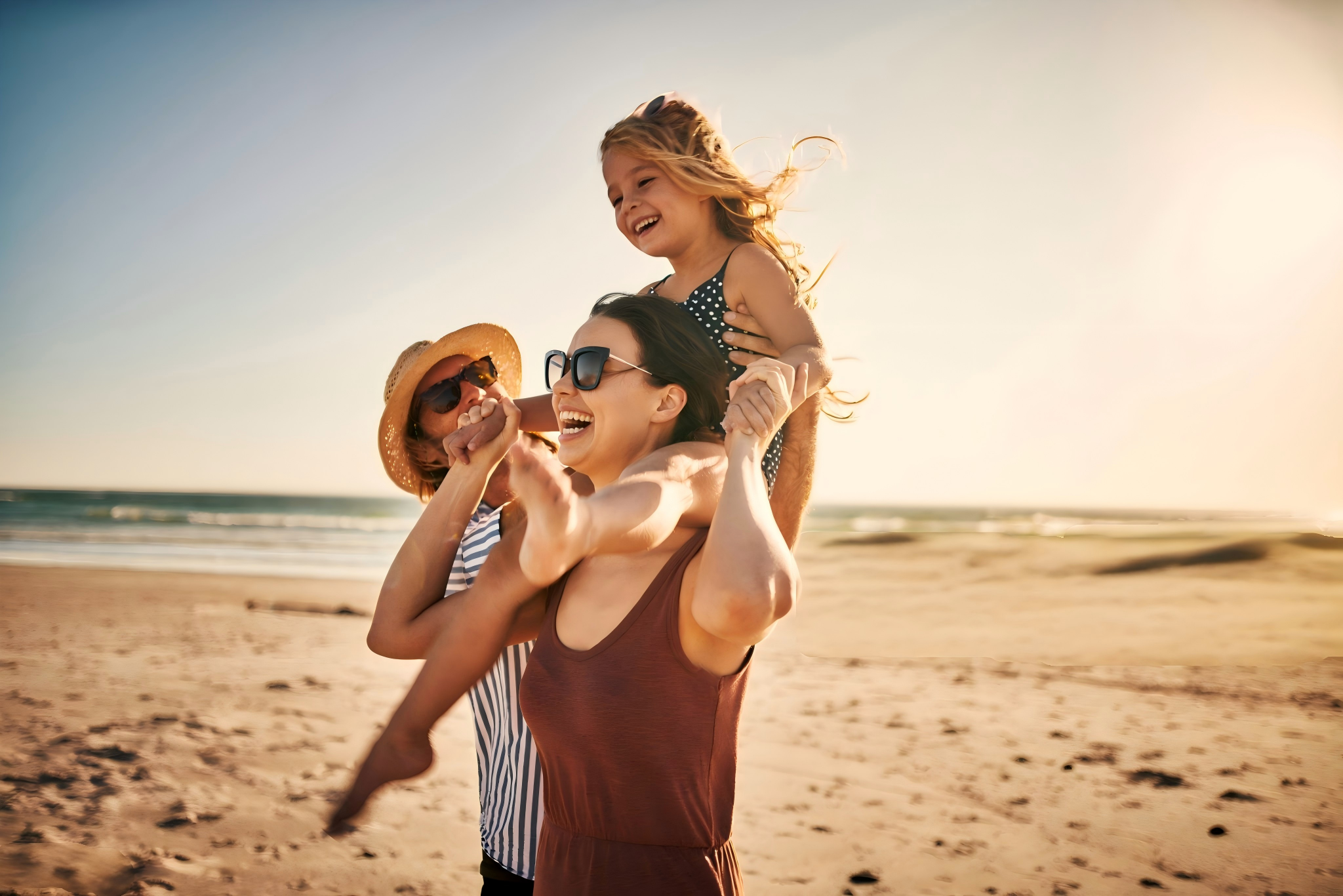Summer beach scene — men's ankle bracelet worn at the beach with family