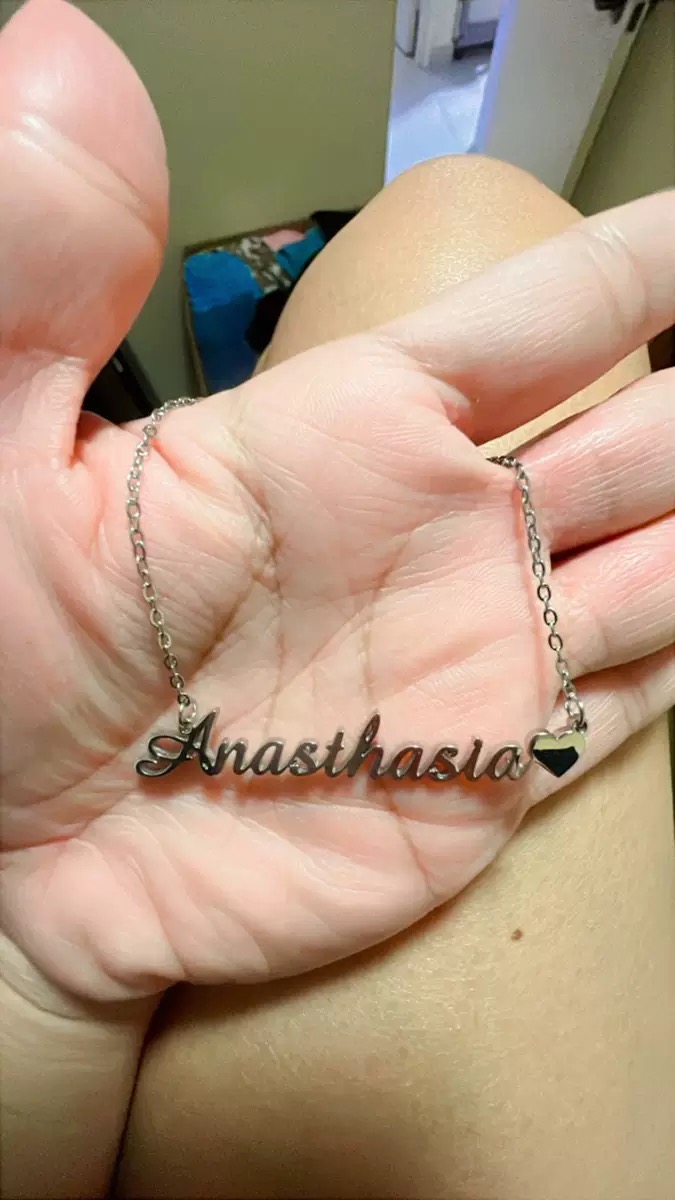 Real customer photo — engraved name anklet