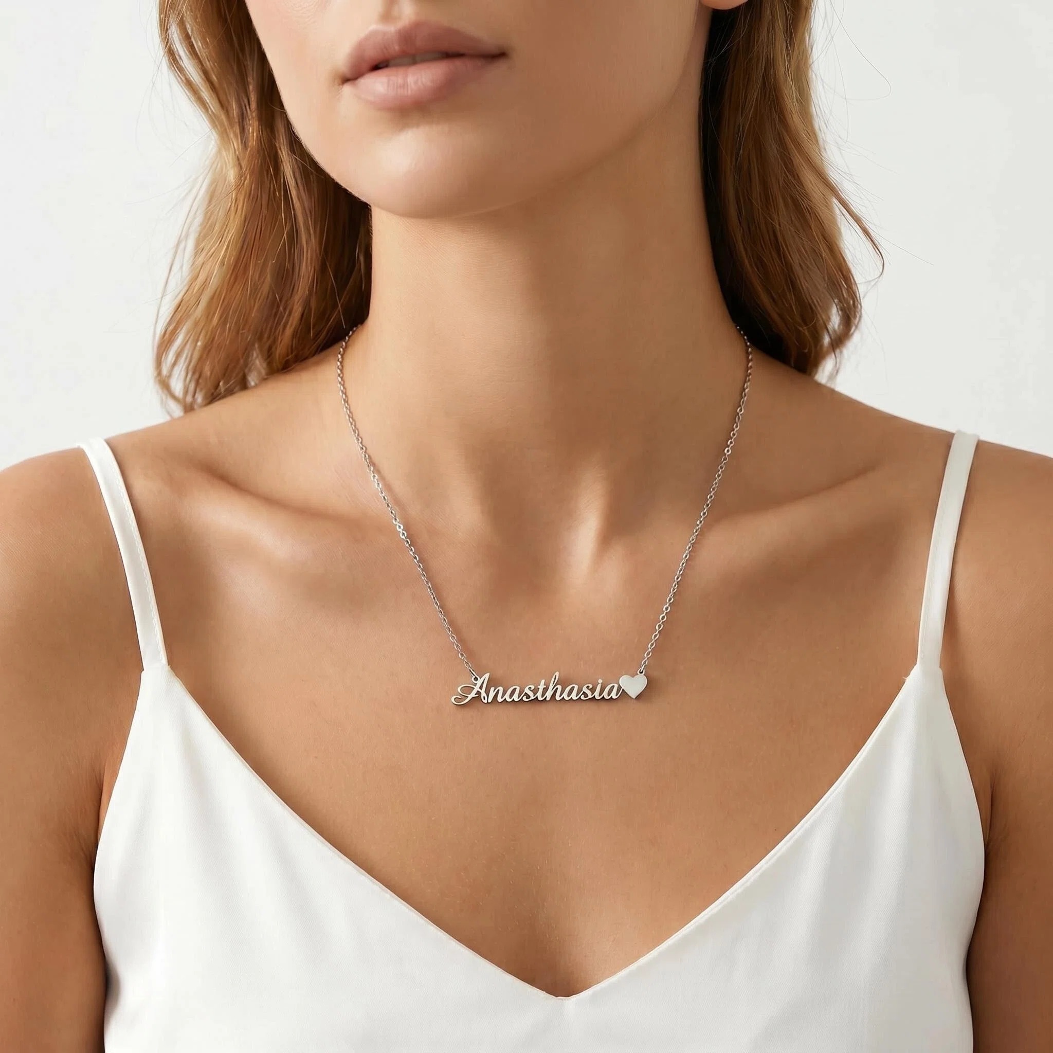 Model wearing silver name necklace — personalized jewelry built for daily wear