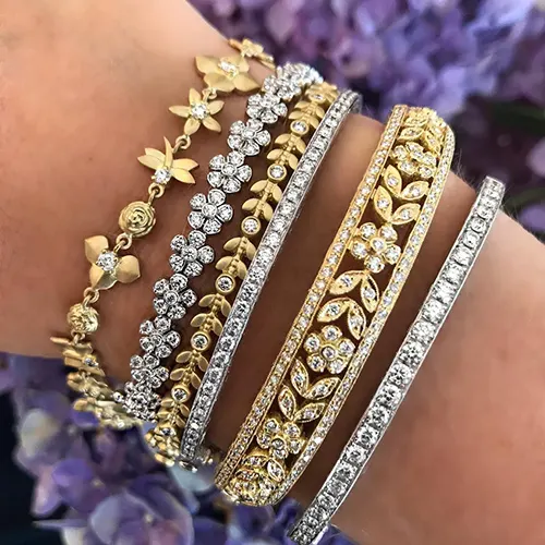 Mixing silver and gold bracelets together — mixed metals stacked wrist jewelry