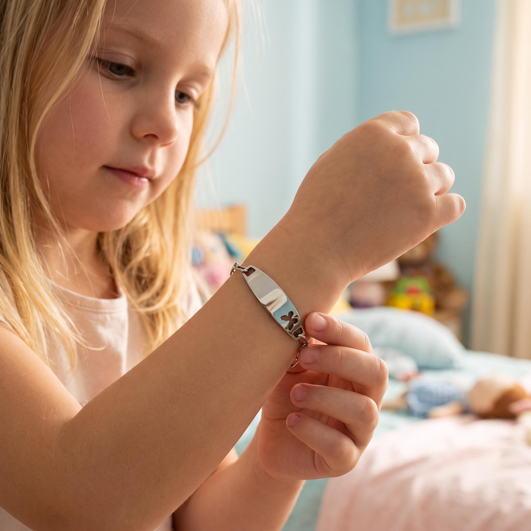 Child wearing personalized kids bracelet — engraved name bracelet on child's wrist