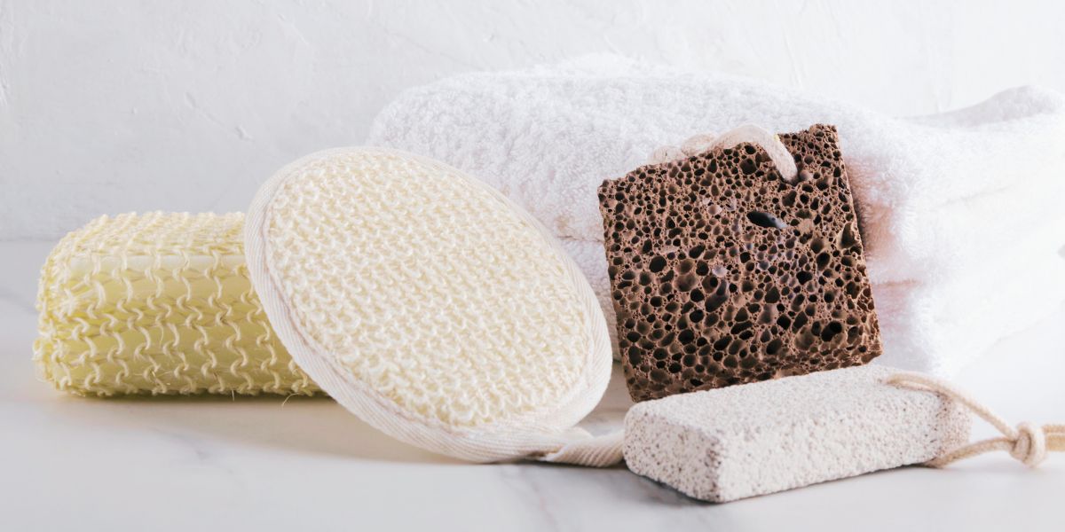 A selection of foot care tools and products including pumice stone, foot file, and foot cream
